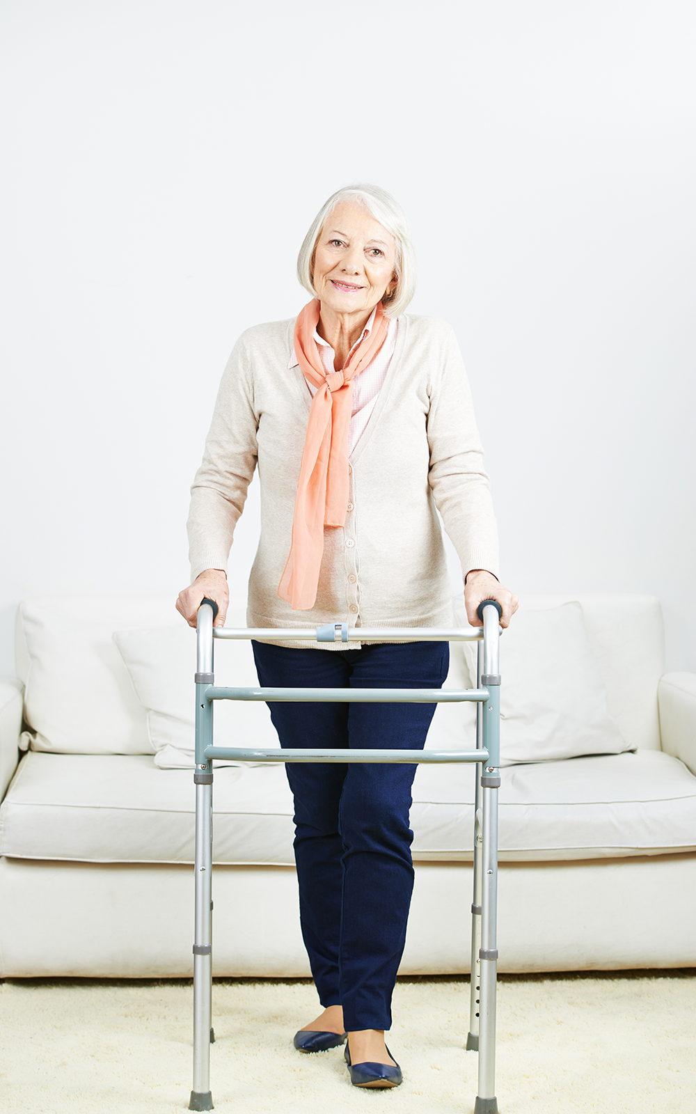 Woman standing with a walker